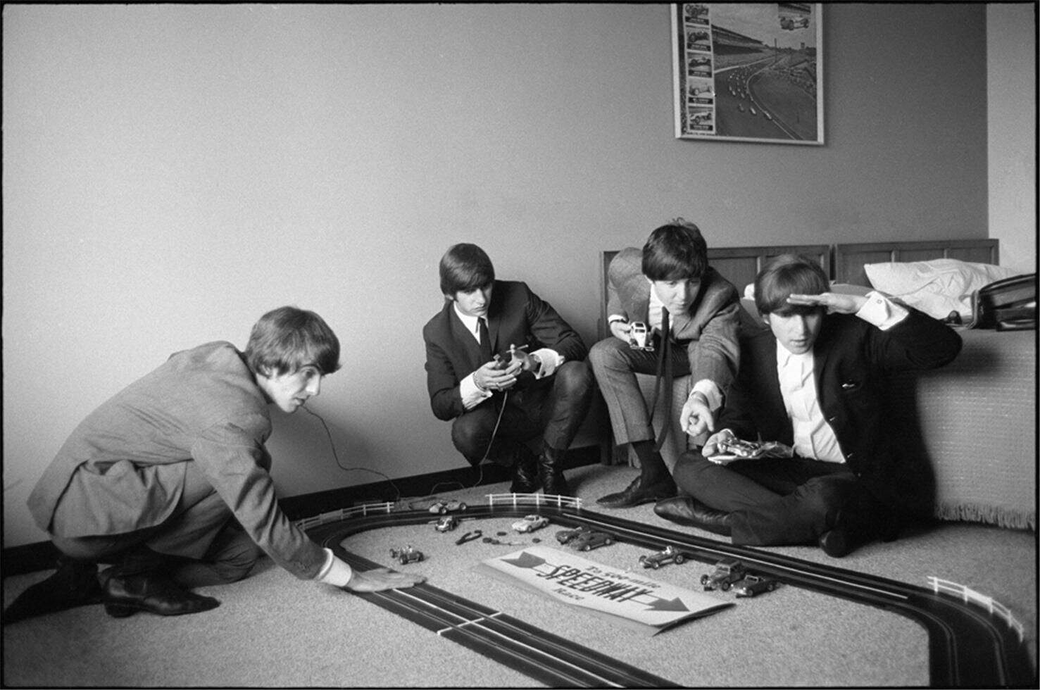 Photograph of The Beatles racing slot cars by Curt Gunther