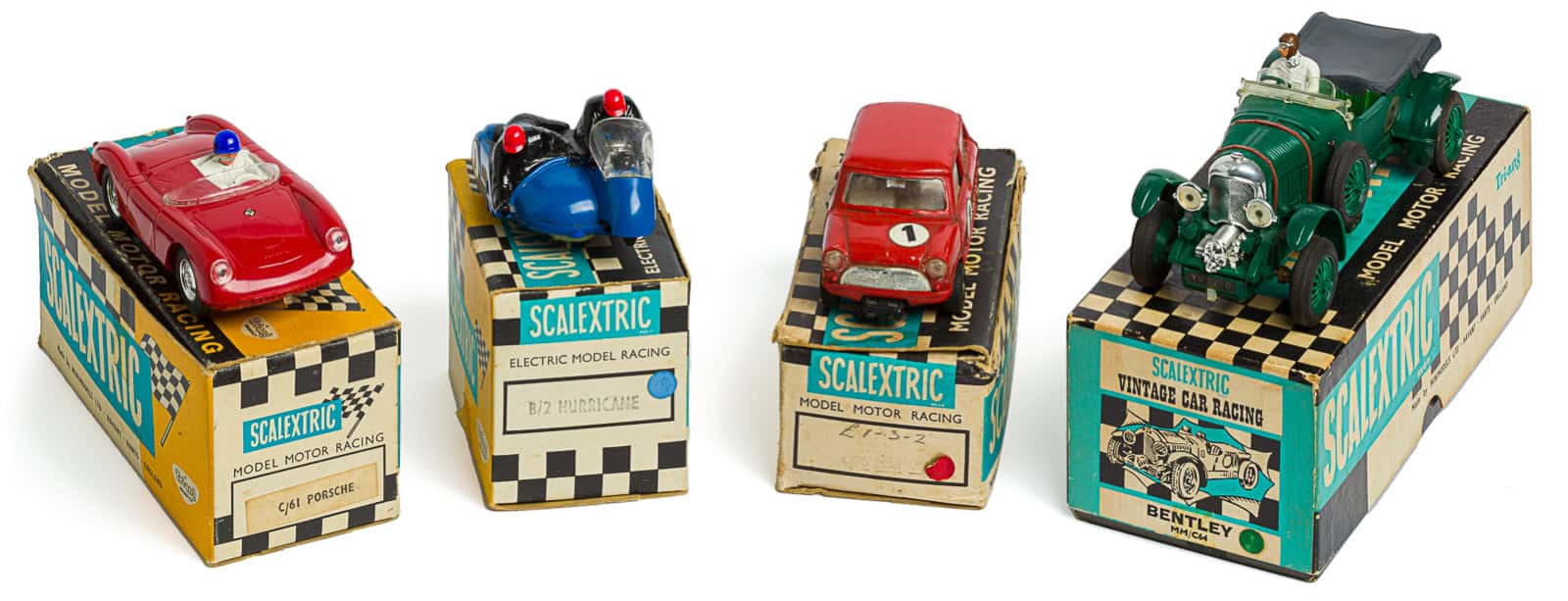 older Scalextric slot cars with original packaging